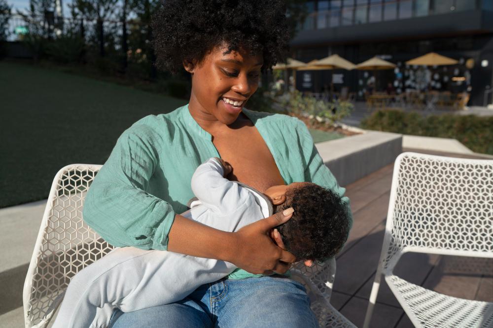 happy mother breastfeeding baby